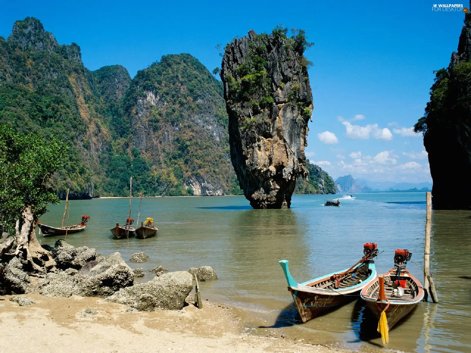 Boats, rocks, sea