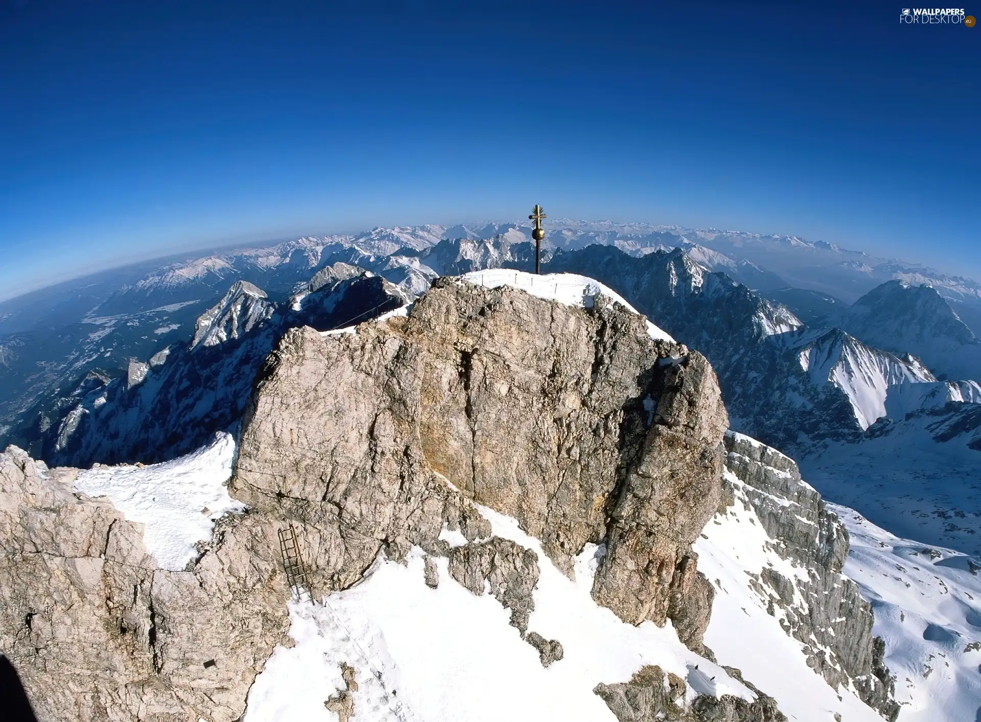 Cross, snow, mountains