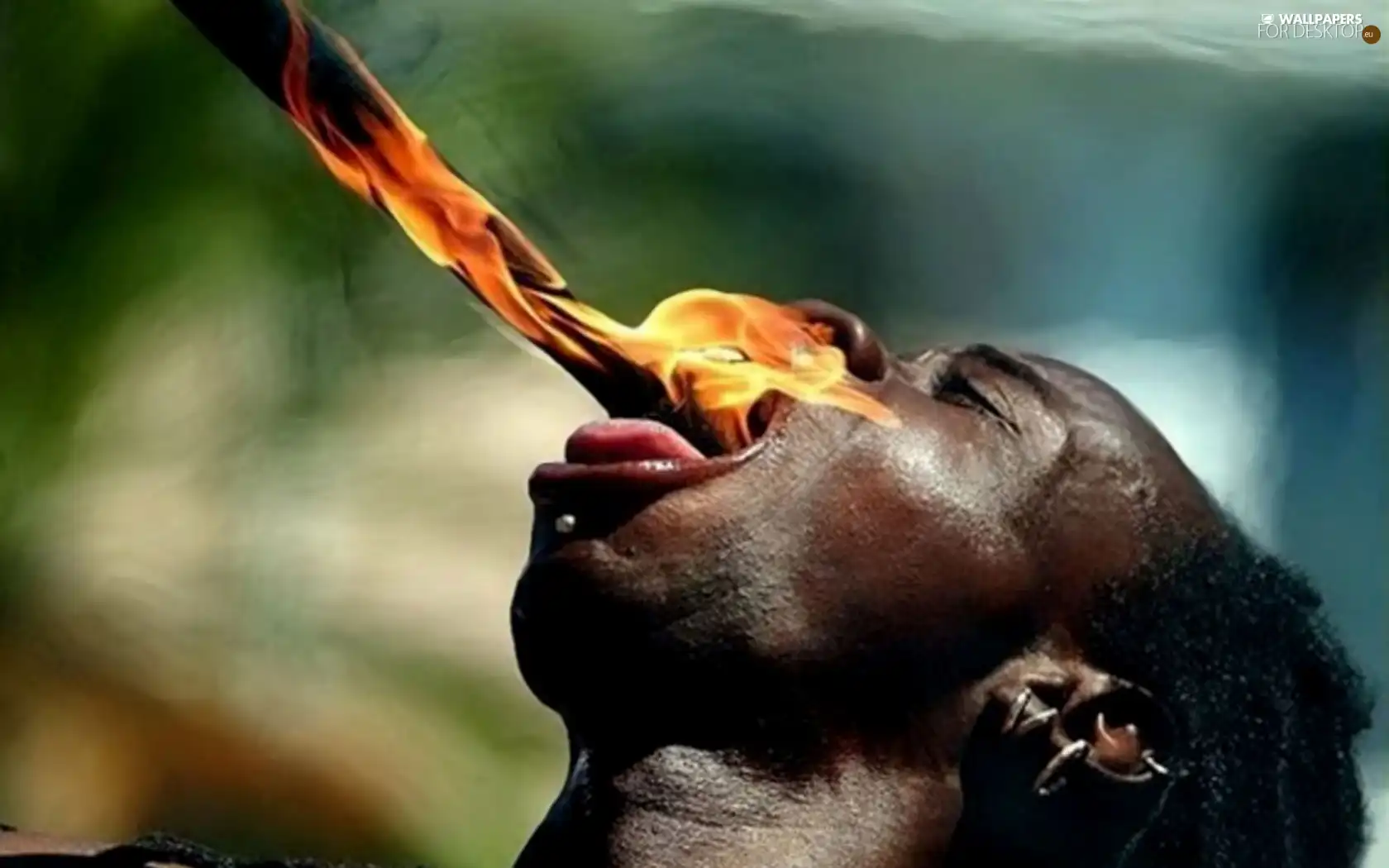 Big Fire, a man, swallowing
