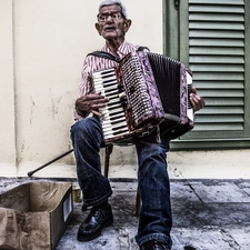 a man, accordion