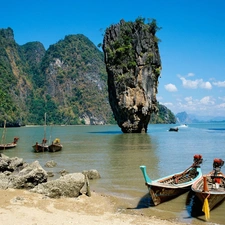 Boats, rocks, sea