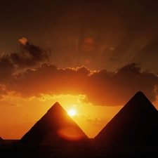 Pyramids, sun, clouds, west