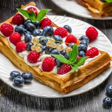 Waffle, raspberries, blueberries, Whipped cream