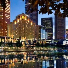 illuminated, by, river, skyscrapers